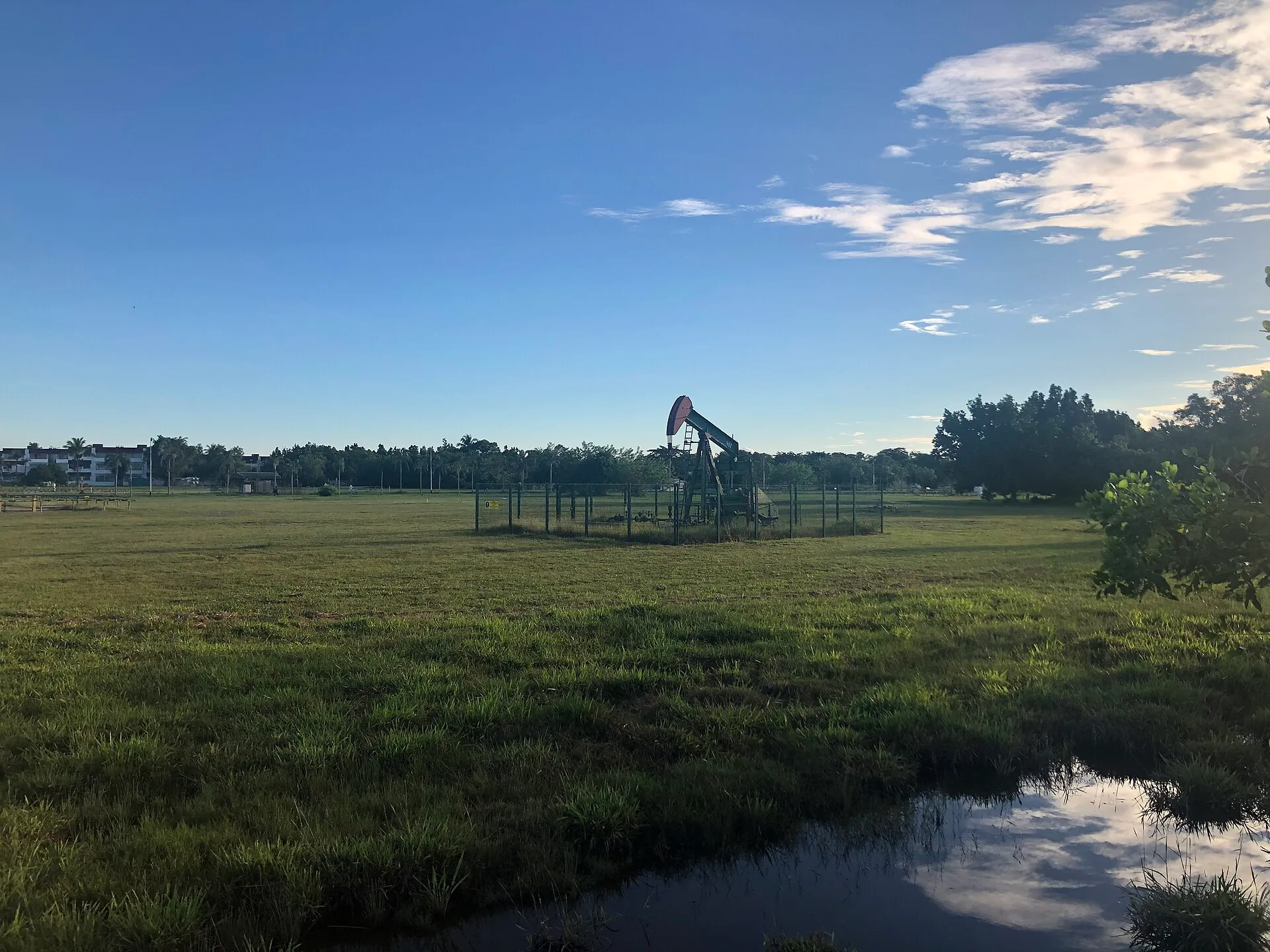 An oil pumpjack in a field