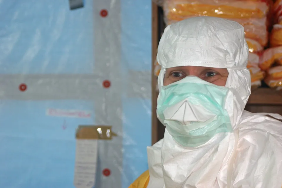 The director of the U.S. Centers for Disease Control and Prevention enters an Ebola treatment unit during an earlier outbreak.