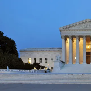 The US Supreme Court building in Washington at dusk