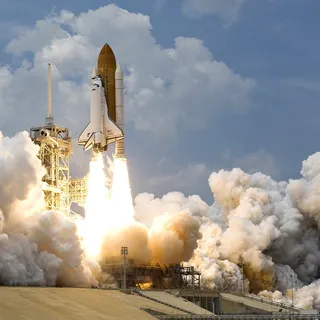 A rocket lifts off from a launch pad